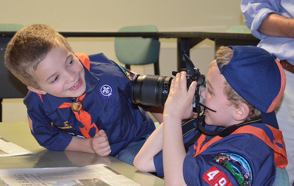 Cub scout Gabriel Grant snaps a close-up of fellow scout John Kaden Smith. Several of their photos can now be seen on the Highland Echo Facebook page. Photo Courtesy of Alex Cawthorn.