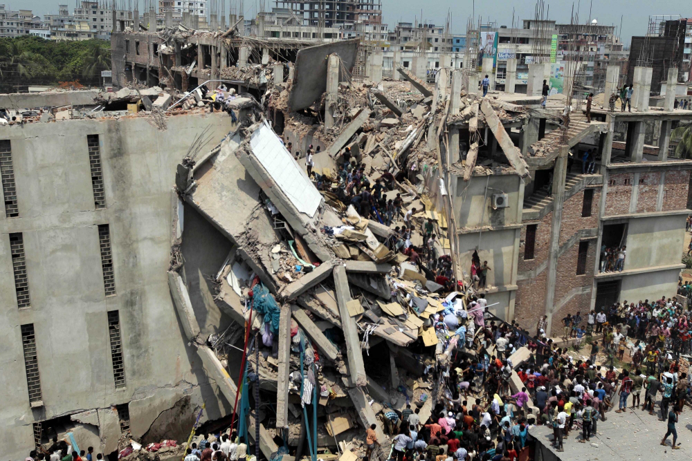 The remains of a textile factory in Bangladesh after its collapse, resulting in the death of 100 workers. Events like these call into question whether or not corporations have an obligation to behave morally and justly. Photo Courtesy of the Associated Press.