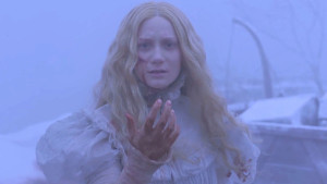 Actress Mia Wasikowska covered in blood stares solemnly into the camera in the opening scene of Crimson Peak. Photo from www.hollywoodreporter.com.
