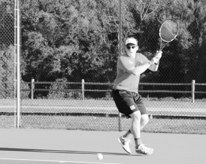Russell takes shot against Johnson University in fall pre-season match. Photo by Ariana Hansen.