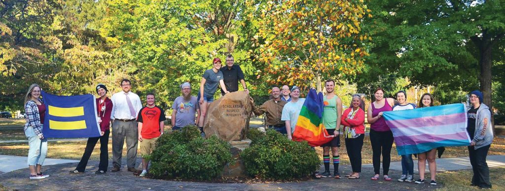 Maryville College’s LGBTQ+ Alliance join together in front of the Covenant Stone to show support for equal rights for all. Photo by Maddie Carpenter.