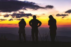 Three Japanese tourist waiting for the sunrise on top of Clingman’s Dome in the Great Smoky Mountains National Park.  Photo by David Peters.