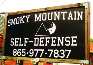 Sign outside of smoky mountain self-defense studio. Courtesy of Smokey Mountain Self Defense Team. Photo by Sherilyn Smith.