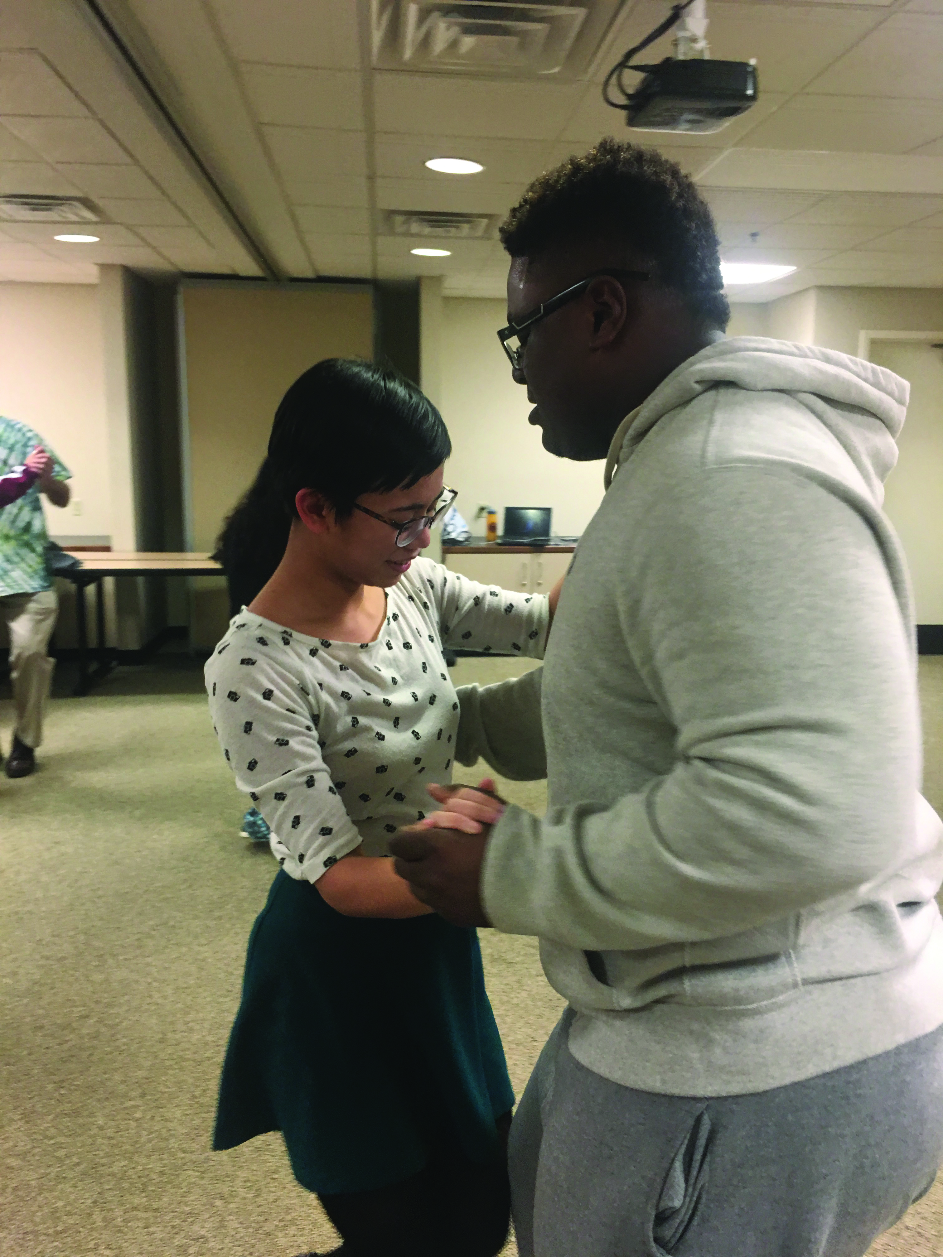 Ginny Guisadio and BSA President Tavon Johnson dance together during the African Dance Class taught by Claudia Pires on Feb. 2. Photo by Tobi Scott.