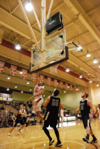 Sophomore Colt Nokes lays the ball off the glass in Maryville’s win over Piedmont. Photo by Conner McCarty.