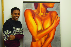 Senior Timela Crutcher stands with a piece from her upcoming thesis presentation which will be titled “And they were Naked and Unashamed.” Photo by Halle Hill.
