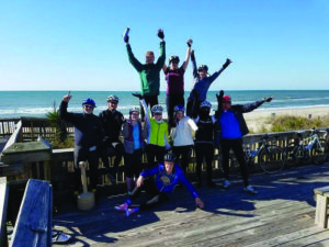 The group stopped for a celebratory pose after reaching their destination of Topsail, North Carolina.