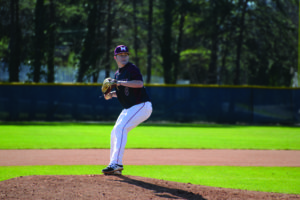 Joe Jones, senior right handed pitcher, pitches ball to the other team. Photo courtesy of MC Athletics.