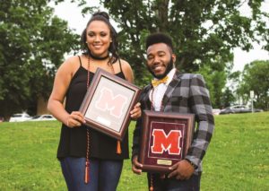 Featured above are Bryan Horton and Abrianna Jones stand with ropes and plaques at the student athlete awards. Photo by David Peters.