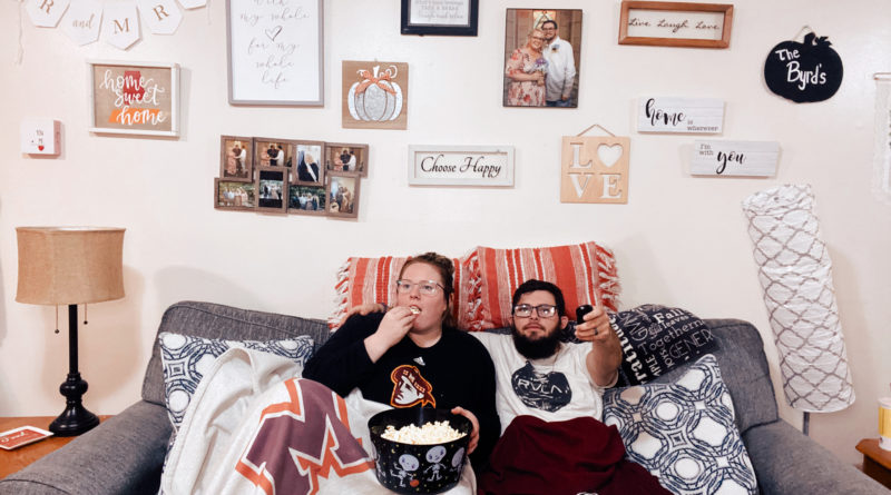Meridith Daffron-Byrd (left) and her husband Hank Byrd (right) watching their favorite TV show “Criminal Minds” while eating popcorn. Photo by Meridith Daffron
