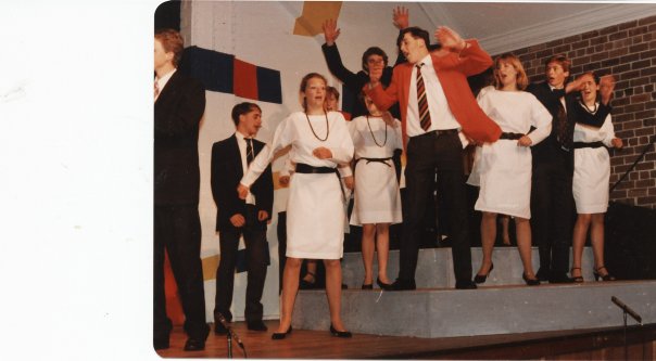 Irvine (center) performed in a musical alongside young Hugh Jackman (second from the right) in high school. Photo Courtesy of Andrew Irvine.