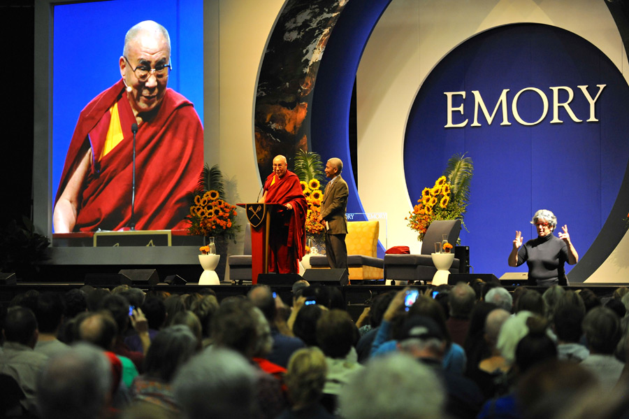 His Holiness the 14th Dalai Lama greets Emory University President James Wagner and his audience. A group of 14 MC students and three professors attended the lecture on Oct. 8. He was joined by a panel of scientists and researchers. Photo Courtesy of Dalailama.com
