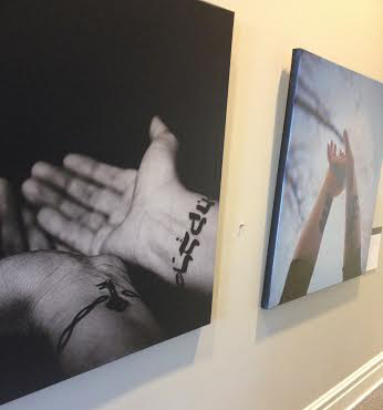 Tattoo photography exploring permanent marks of faith is on display in Bartlett Hall. The exhibit will remain in place until the end of March. Photo Courtesy of Evy Linkous.