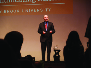Alan Alda delivers a lecture on science communication. Photo by Adam Brown.
