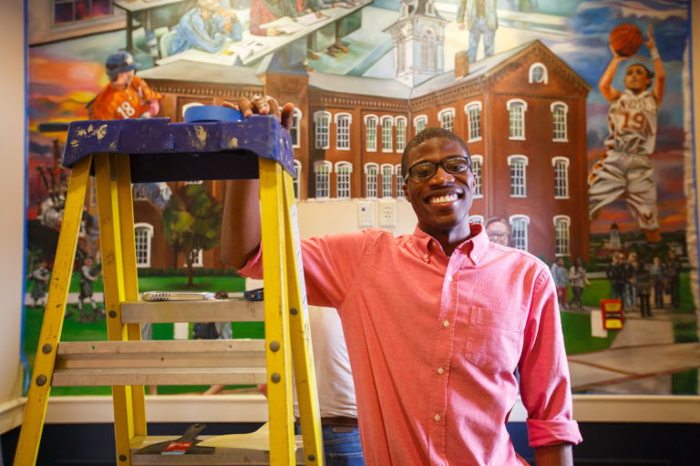 Alumnus Brian Reid ’16 paints MC-themed mural for campus building