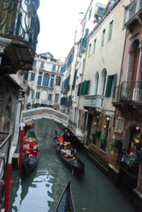 The cannels of Venice, Italy. A popular transportation and fun activity for tourists is to take gondola rides throughout the small cannels in the city.