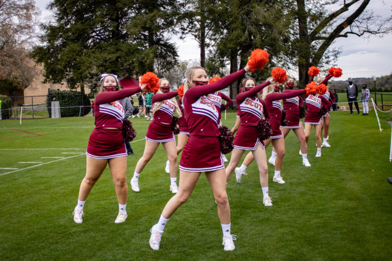 Maryville College cheerleaders motivate the Scots during first (and rainy) home game